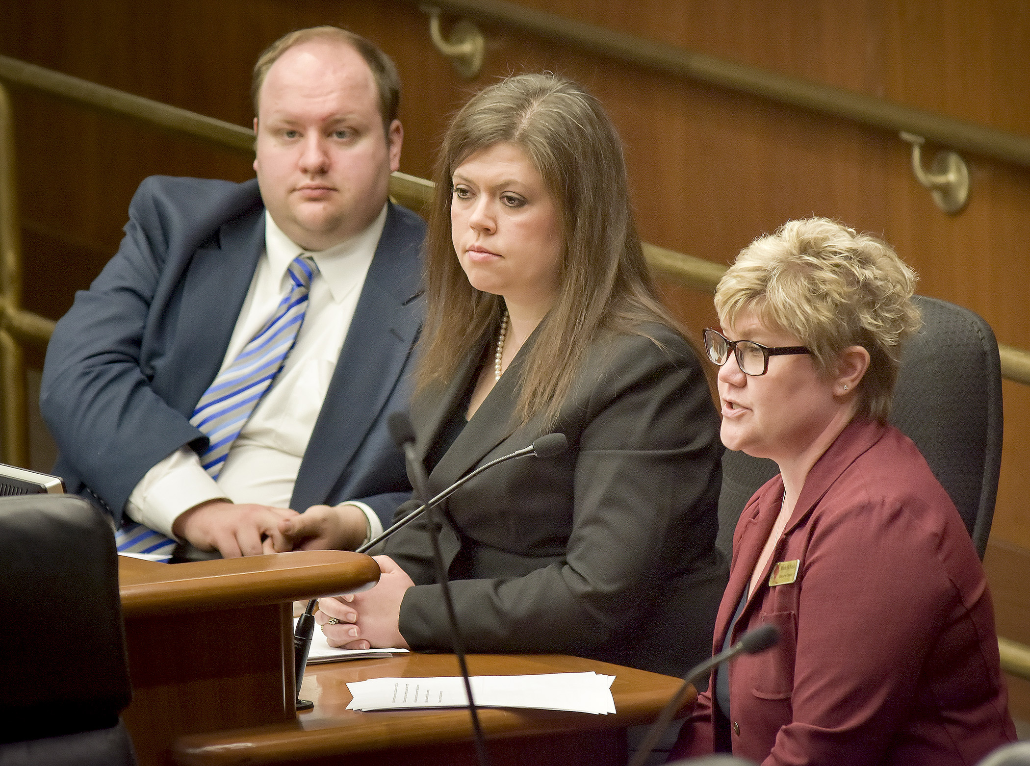 Michelle Nash, right, owner of Legacy Care Home LLC in Minnetonka, and Danielle Lesmeister, center, director of St. Francis Health Services in Morris, testify before the House Subcommittee on Aging and Long-Term Care Feb. 15 in support of a bill sponsored by Rep. Joe Schomacker, left, that would reform the elderly waiver program. Photo by Andrew VonBank
